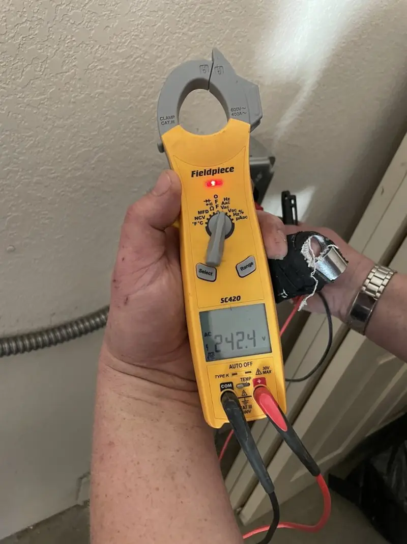 Voltage testing with clamp meter during Hot Tub / Pool Electrical Wiring in Windsor